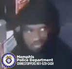 A surveillance-style image showing an individual standing near what appears to be a gas pump or similar equipment. The person is wearing dark clothing and is positioned slightly off-center. The background includes part of a fuel dispenser with visible labels and signage. In the bottom-left corner, the Memphis Police Department seal and the text “Memphis Police Department CRIMESTOPPERS 901-528-CASH” are displayed.
