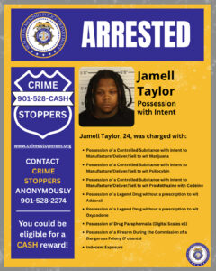 "A rectangular arrest‑announcement flyer with a yellow background and a blue header. The top features the Memphis Police Department seal and large white text that reads “ARRESTED.” On the right side, there is a booking‑style photo placeholder and text identifying an individual named Jamell Taylor with the label “Possession with Intent.” Below, text states that Jamell Taylor, age 24, was charged with multiple offenses, including several controlled‑substance charges related to marijuana, psilocybin, and promethazine with codeine; possession of legend drugs without prescriptions for Adderall and Oxycodone; possession of drug paraphernalia including six digital scales; possession of a firearm during the commission of a dangerous felony with seven counts; and indecent exposure. On the left side, a blue Crime Stoppers panel shaped like a badge displays “CRIME STOPPERS 901‑528‑CASH,” the website “www.crimestopmem.org,” information encouraging anonymous contact at 901‑528‑2274, and a note about eligibility for a cash reward. A small Memphis Police Department seal appears in the lower right corner."