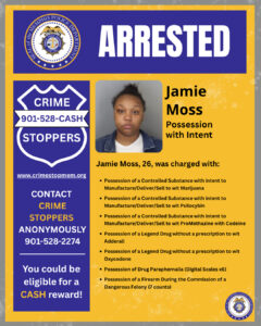 "A yellow and blue arrest‑announcement flyer with a blue header that reads “ARRESTED” alongside the Memphis Police Department seal. On the right side, a booking‑style photo placeholder appears above the name “Jamie Moss” with the label “Possession with Intent.” Text states that Jamie Moss, age 26, was charged with multiple offenses including controlled‑substance charges for marijuana, psilocybin, and promethazine with codeine; possession of legend drugs without prescriptions for Adderall and Oxycodone; possession of drug paraphernalia including six digital scales; and seven counts of possession of a firearm during the commission of a dangerous felony. On the left side, a blue Crime Stoppers badge‑shaped panel includes the text “CRIME STOPPERS 901‑528‑CASH,” the website “www.crimestopmem.org,” instructions to contact Crime Stoppers anonymously at 901‑528‑2274, and a note stating eligibility for a cash reward. A small Memphis Police Department seal is in the lower right corner."