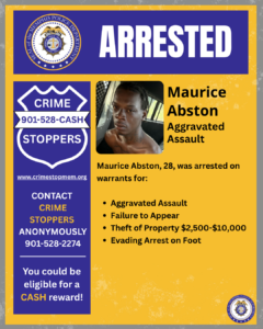 A rectangular poster with a yellow background and purple accents displays the word “ARRESTED” in large white letters at the top. On the left side, there is a blue and white “Crime Stoppers” badge graphic with the phone number 901-528-CASH and the website crimestopmem.org. Beneath it, text says “Contact Crime Stoppers Anonymously 901-528-2274” and “You could be eligible for a cash reward!”
In the center-right area, there is a photograph of an individual seated inside a vehicle. Next to the photograph, text reads: “Maurice Abston — Aggravated Assault.” Below that, additional text states: “Maurice Abston, 28, was arrested on warrants for:” followed by a bullet list:
• Aggravated Assault
• Failure to Appear
• Theft of Property $2,500–$10,000
• Evading Arrest on Foot
The bottom right corner contains the Memphis Police Department seal.