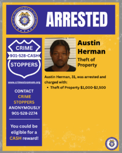 A rectangular poster with a blue and yellow color scheme titled “ARRESTED” at the top, featuring the seal of the Memphis Police Department. Below the title, there is a booking-style photograph of an individual from the shoulders up. To the right of the photograph, bold text reads “Austin Herman” followed by “Theft of Property.” Additional text states: “Austin Herman, 31, was arrested and charged with: • Theft of Property $1,000–$2,500.” On the left side of the poster, there is a blue vertical panel with a white badge-shaped logo that reads “CRIME STOPPERS 901-528-CASH,” along with the website “www.crimestopmem.org.” Below that, text says: “Contact Crime Stoppers Anonymously 901-528-2274.” Near the bottom of the panel, text reads: “You could be eligible for a cash reward!” The bottom right corner features a small Memphis Police Department seal.