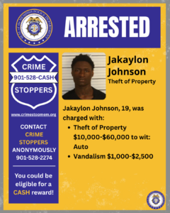 An informational poster with a blue and yellow color scheme displaying the large heading ‘ARRESTED’ at the top, alongside a circular Memphis Police Department seal. Below the heading, there is a booking-style photograph framed in yellow. To the right of the photograph, bold text reads ‘Jakaylon Johnson’ with the subheading ‘Theft of Property.’ Additional text states that the individual, age 19, was charged with two offenses: theft of property valued between $10,000 and $60,000 involving an automobile, and vandalism valued between $1,000 and $2,500. On the left side of the poster, a blue shield-shaped graphic contains the text ‘CRIME STOPPERS 901‑528‑CASH’ with a website link. Beneath this, more text encourages contacting Crime Stoppers anonymously and notes eligibility for a cash reward. A small Memphis Police Department seal appears in the lower-right corner of the poster.