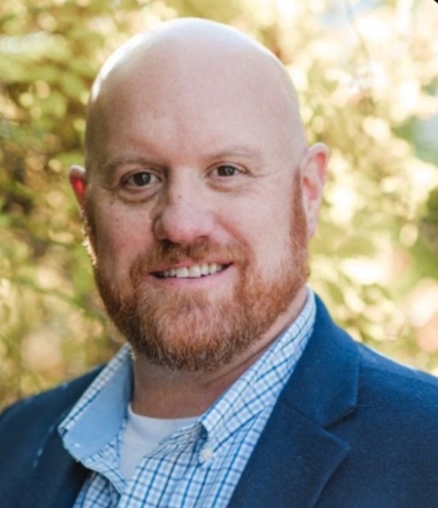 a headshot of Dan Brown