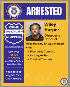 A rectangular Memphis Police Department poster uses blue, yellow, and white colors. At the top, the department’s circular seal appears on the left, and the word “ARRESTED” is displayed in large white letters on a blue background.
Below, the left side contains a badge‑shaped graphic labeled “CRIME STOPPERS” with the phone number 901‑528‑CASH. Beneath the badge is the website www.crimestopmem.org. Additional text reads:
“CONTACT CRIME STOPPERS ANONYMOUSLY 901‑528‑2274
You could be eligible for a CASH reward!”
In the center is a mugshot‑style photograph of one individual placed against a plain background. The individual is wearing a dark shirt.
To the right of the photograph, text reads:
“Wiley Harper
Disorderly Conduct”
Below that, more text reads:
“Wiley Harper, 30, was charged with:
• Disorderly Conduct
• Inciting to Riot
• Criminal Trespass”
A small Memphis Police Department seal appears in the bottom right corner.