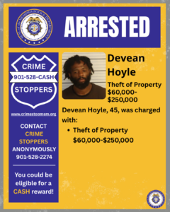 A rectangular poster with a blue and yellow background. At the top, a wide blue banner displays the word “ARRESTED” in large white letters. To the left of the banner is a circular seal labeled “City of Memphis Police Department.” Below this, on the left side of the poster, there is a large blue shield-shaped graphic with white text that reads: “CRIME STOPPERS 901-528-CASH.” Underneath is the website “www.crimestopmem.org,” followed by additional text: “CONTACT CRIME STOPPERS ANONYMOUSLY 901-528-2274 You could be eligible for a CASH reward!” To the right of the shield graphic, there is a rectangular photo showing one individual positioned in front of a height chart background. To the right of the photo, black text reads: “Devean Hoyle Theft of Property $60,000–$250,000 Devean Hoyle, 45, was charged with: • Theft of Property $60,000–$250,000” A small Memphis Police Department seal appears in the bottom right corner of the poster.
