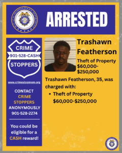 A rectangular poster with a blue and yellow background. At the top, a wide blue banner contains the word “ARRESTED” in large white letters. To the left of the banner is a circular seal labeled “City of Memphis Police Department.” Below this, on the left side, there is a large blue shield-shaped graphic with white text that reads: “CRIME STOPPERS 901‑528‑CASH.” Under the shield is the website “www.crimestopmem.org,” followed by additional text: “CONTACT CRIME STOPPERS ANONYMOUSLY 901‑528‑2274 You could be eligible for a CASH reward!” To the right of the shield graphic, there is a rectangular photo showing one individual positioned in front of a height chart background. To the right of the photo, black text reads: “Trashawn Featherson Theft of Property $60,000–$250,000 Trashawn Featherson, 35, was charged with: • Theft of Property $60,000–$250,000” In the bottom right corner of the poster, there is a small circular Memphis Police Department seal.