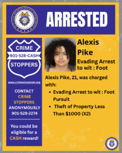 A rectangular poster with a yellow and blue layout. At the top, a wide blue banner displays the word “ARRESTED” in large white letters. To the left of the banner is a circular seal labeled “City of Memphis Police Department.” On the left side of the poster, beneath the banner, there is a large blue shield-shaped graphic with white text that reads: “CRIME STOPPERS 901‑528‑CASH.” Below the shield is the website “www.crimestopmem.org,” followed by additional text: “CONTACT CRIME STOPPERS ANONYMOUSLY 901‑528‑2274 You could be eligible for a CASH reward!” To the right of the shield graphic, there is a rectangular photo showing one individual positioned in front of a height chart background. To the right of the photo, black text reads: “Alexis Pike Evading Arrest to wit: Foot Alexis Pike, 21, was charged with: • Evading Arrest to wit: Foot Pursuit • Theft of Property Less Than $1000 (X2)” In the bottom right corner of the poster, there is a small circular Memphis Police Department seal.
