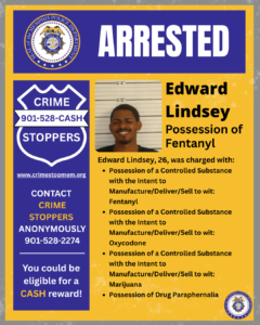 A poster-style graphic has a yellow background with a wide blue banner at the top displaying the word “ARRESTED” in large white letters. In the top-left corner is a circular seal labeled “Memphis Police Department.” On the left side of the poster is a blue shield-shaped graphic containing the text: “CRIME STOPPERS 901-528-CASH,” the website “www.crimestopmem.org,” the instruction “CONTACT CRIME STOPPERS ANONYMOUSLY 901-528-2274,” and the message “You could be eligible for a CASH reward!” Near the center of the poster is a booking-style photograph of one individual from the shoulders up, positioned in front of a height measurement background showing marks for 6'0" and 6'4". To the right of the image, large bold text reads: “Edward Lindsey – Possession of Fentanyl.” Below this heading, additional text reads: “Edward Lindsey, 26, was charged with:” followed by bullet points listing several charges. The charges include possession of controlled substances with intent to manufacture, deliver, or sell—including fentanyl, oxycodone, and marijuana—and possession of drug paraphernalia. In the bottom-right corner is another Memphis Police Department seal.