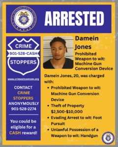 A rectangular graphic with a yellow background and blue header elements displays an announcement from the Memphis Police Department. At the top, a large blue banner contains white text that says “ARRESTED,” alongside the department’s circular seal. On the left side, there is a blue Crime Stoppers badge‑shaped logo with the text “CRIME STOPPERS 901‑528‑CASH” and the website “www.crimestopmem.org.” Below it, additional text reads: “CONTACT CRIME STOPPERS ANONYMOUSLY 901‑528‑2274. You could be eligible for a CASH reward!” On the right side, there is a rectangular photograph of an unidentified individual in front of a background with horizontal lines. To the right of the photo, printed text reads: “Damein Jones. Prohibited Weapon to wit: Machine Gun Conversion Device.” Underneath, more text states: “Damein Jones, 20, was charged with:” followed by four bullet points: “Prohibited Weapon to wit: Machine Gun Conversion Device,” “Theft of Property $2,500–$10,000,” “Evading Arrest to wit: Foot Pursuit,” and “Unlawful Possession of a Weapon to wit: Handgun.” A small Memphis Police Department seal appears in the bottom right corner.