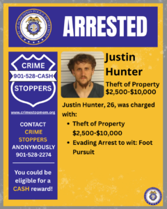 A rectangular graphic with a yellow background and blue accents displays an arrest notice from the Memphis Police Department. At the top, a wide blue banner contains large white text reading “ARRESTED,” alongside the department’s circular seal. On the left side of the graphic, a blue badge‑shaped Crime Stoppers logo includes the text “CRIME STOPPERS 901‑528‑CASH” and the website “www.crimestopmem.org.” Below the logo, additional text reads: “CONTACT CRIME STOPPERS ANONYMOUSLY 901‑528‑2274. You could be eligible for a CASH reward!” On the right side, there is a rectangular photograph of an unidentified individual in front of a background with horizontal measurement lines. To the right of the photo, printed text states: “Justin Hunter. Theft of Property $2,500–$10,000.” Beneath this, additional text reads: “Justin Hunter, 26, was charged with:” followed by two bullet points: “Theft of Property $2,500–$10,000” and “Evading Arrest to wit: Foot Pursuit.” A smaller Memphis Police Department seal appears in the bottom right corner.